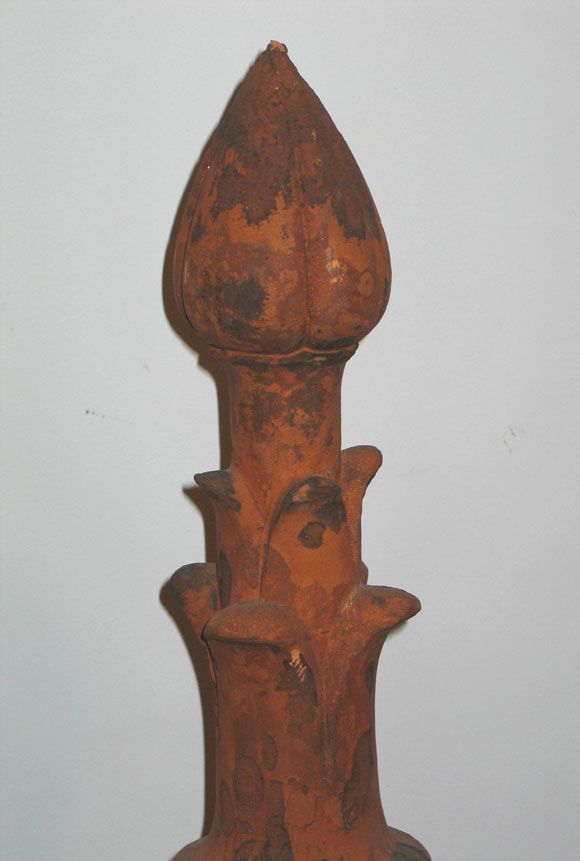 Decorative, architectural roof tower ornament in terra cotta composed of three parts which fit together. This and similar pieces sat elegantly on the towered slate roofs of large French, late 19th-early 20th century homes.

References: Belle