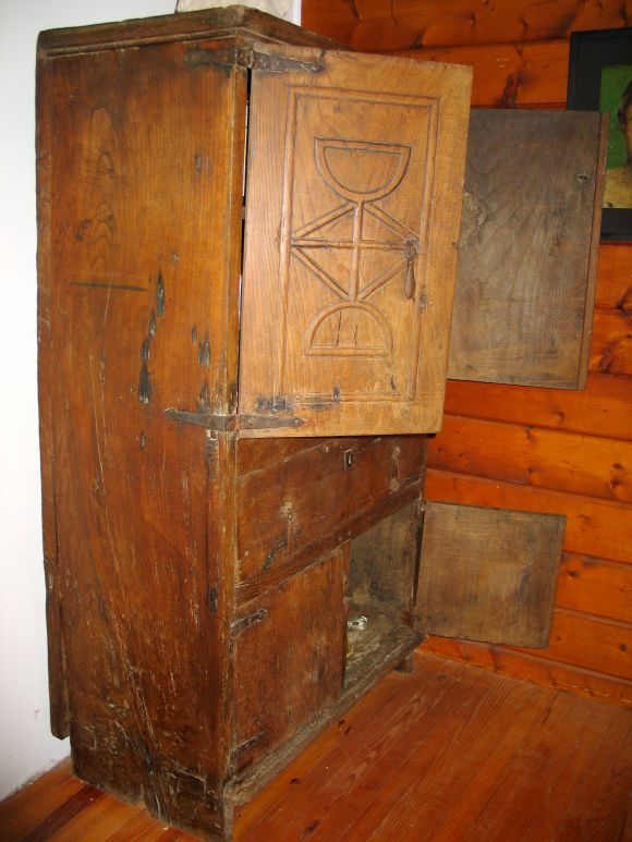 Rare 17th Century Cabinet from Celtic Regions of France/Spain with Hand Carved Doors, Center Drawer and Lower Storage Area with 2 Doors. Carving Represents the Celtic Cross and 2 Wine Cups Symbolic of the Grail.