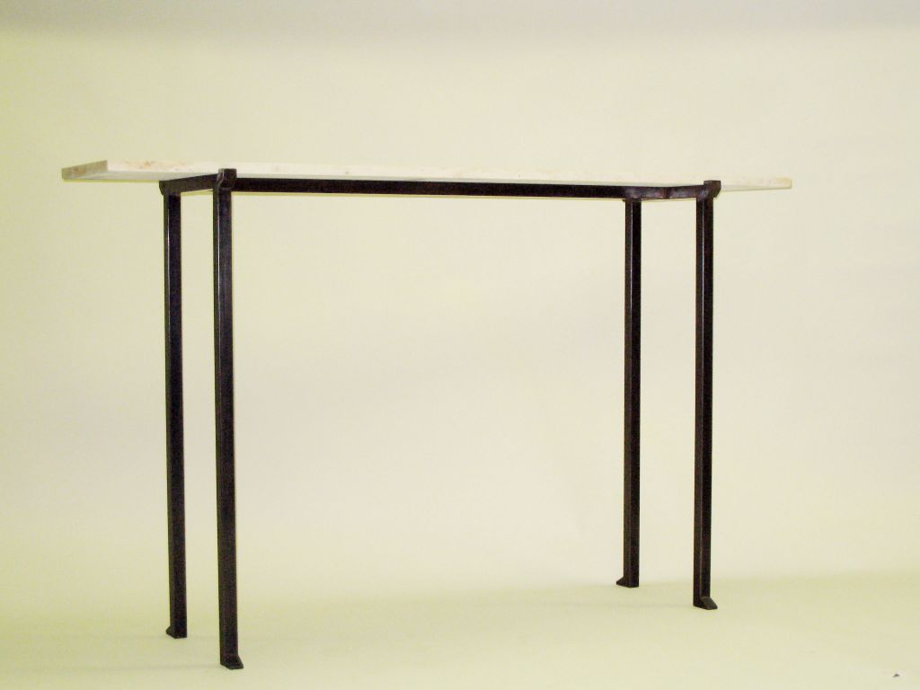 2 Elegant French mid-century style consoles or sofa tables in the modern neoclassical spirit with bronzed wrought iron bases and limestone tops. The tops of the bronzed iron frames are delicately notched for the stone to fit securely and the feet