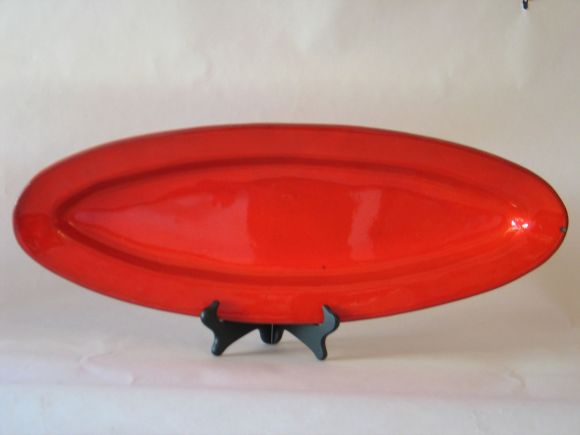 Two elegant large handmade platters, serving dishes in a pure form and contrasted with a bright red glaze by Voltz, from the Vallauris, France ceramic center. Voltz was a contemporary of Picasso at Vallauris in the 1950s. 

Two pieces are