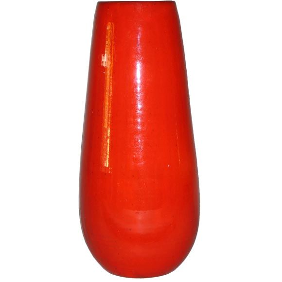 Tall elegant French Mid-Century earthenware vase in a dynamic bright red glaze by Voltz, a ceramic artist who worked at Vallauris during the time of Picasso's tenure. 

Signed on bottom. Voltz, Vallauris, France.