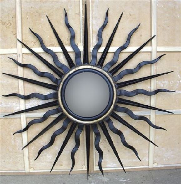 Pair of Large Dramatic Sunburst / Star / Starburst Wall Mirrors in Patinated Wrought Iron and Gold Leaf. Mirrors are 57