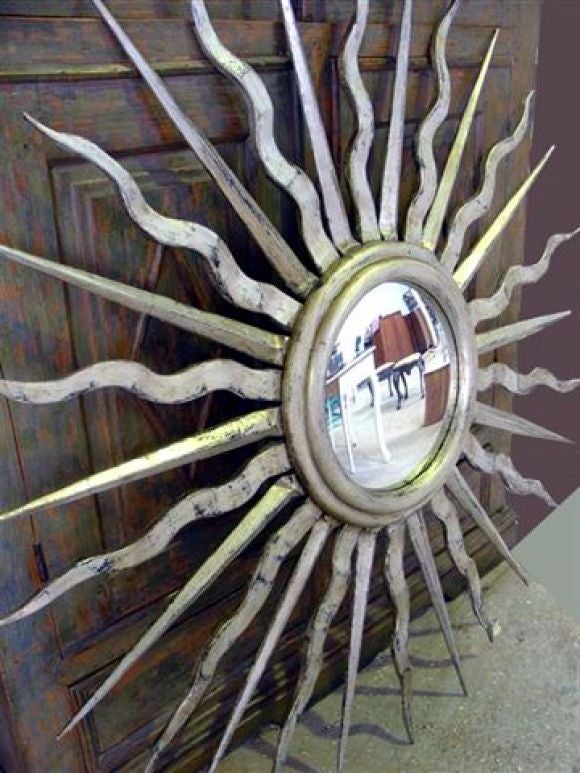 large silver sunburst mirror