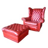 Pair of French Leather Tufted Armchairs with Ottoman