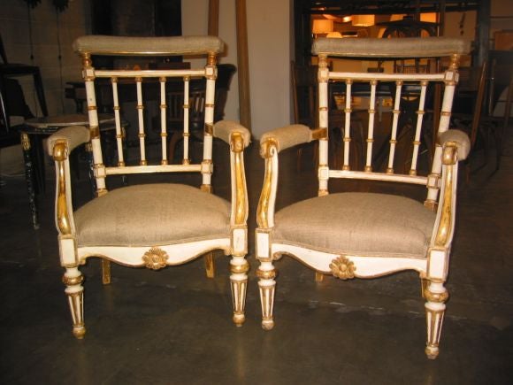 Elegant original gold leaf armchairs -- check out the sofa and other chairs as well.