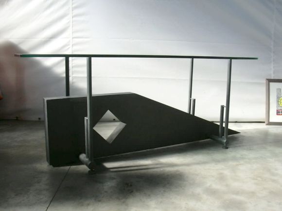 Sculptural iron base with thick glass top