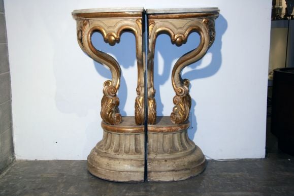 Beautiful 1840s Italian painted corner consoles with original marble tops.