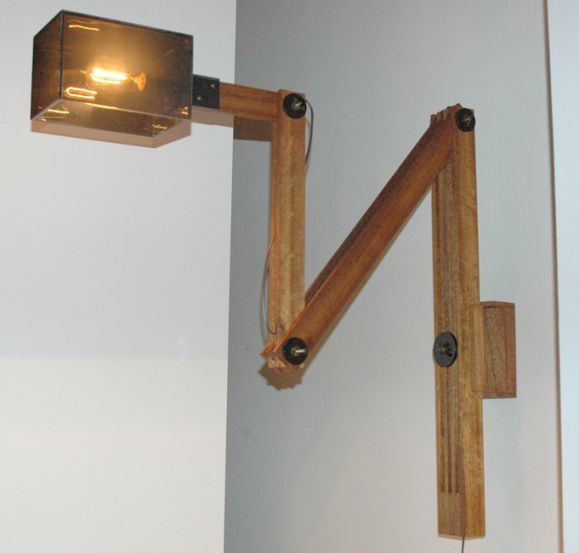Custom wall fixture made of wood and acrylic, fully adjustable capability, extending horizontally to 59 inches with vertical slide. Wired for US junction boxes. Takes one E26 75w maximum bulb