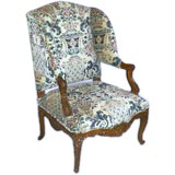 French 19th century finely carved and upholstered wing chair.