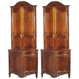 Pair of outstanding French 19th century walnut corner cupboards