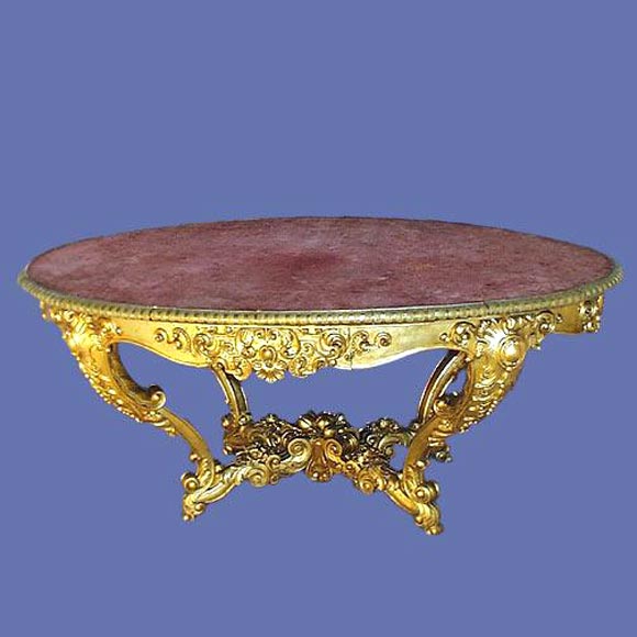 Outstanding Italian 19th century finely carved and gilt oval center table with scalloped bronze perimeter and highly carved apron, legs and stretcher.<br />
FOR MORE INFORMATION, PLEASE VISIT WWW.CONNOISSEURANTIQUES.COM