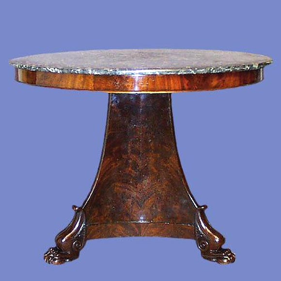 French flame mahogany Empire gueridon table with gray veined marble top on triangular lion footed pedestal base.<br />
FOR MORE INFORMATION, PLEASE VISIT WWW.CONNOISSEURANTIQUES.COM