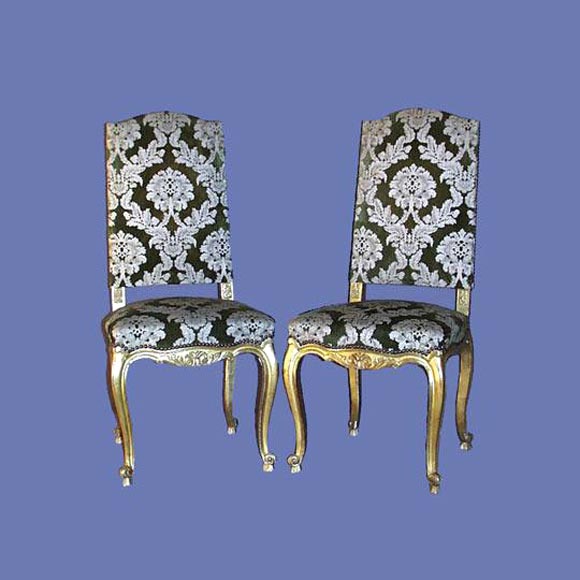 Set of four-French  carved and gilt upholstered side chairs.