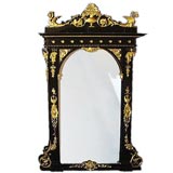 Outstanding French 19th century carved, gilt and ebonized mirror