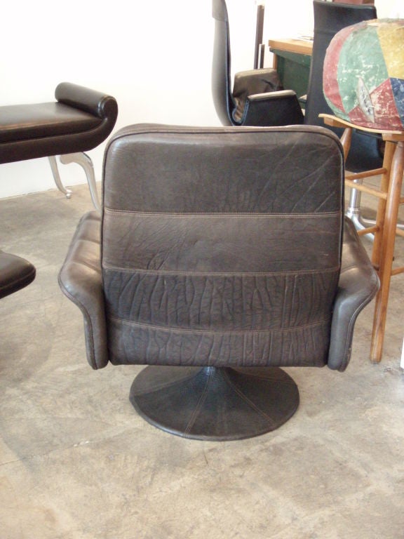 Dark brown water buffalo leather with matching ottoman measuring 18