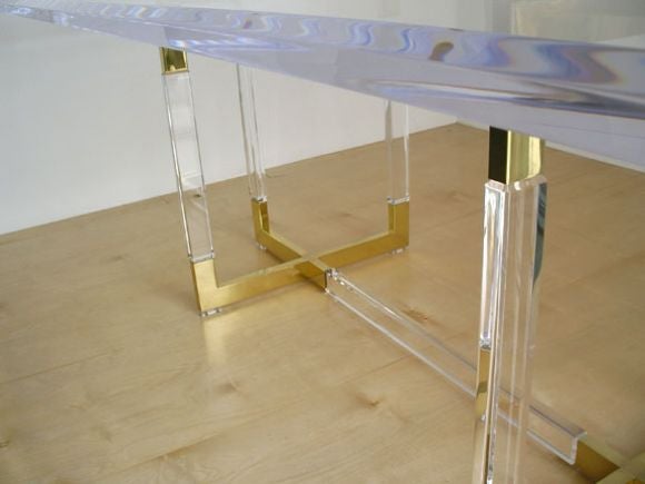 Stunning Lucite and polished brass table designed by Charles Hollis Jones. The beveled  Lucite top is 1.5 inches thick.