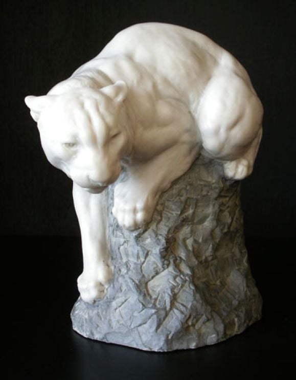 White cougar sculpture by Joseph Boulton. Signed in base. Made of molded powdered stone.