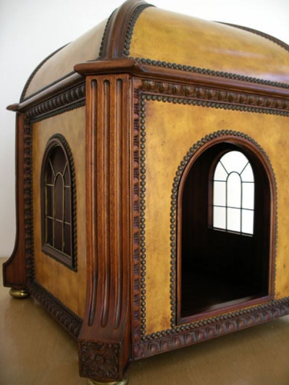 Dog house. Ocher leather exterior with carved wood. Brass tacks, feet, ornamentation and window frames. Interior is completely paneled with wood, including the vaulted ceiling. Top quality craftmanship and materials. Made by Maitland-Smith. The door