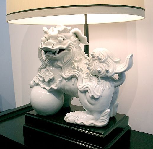 Large white glazed ceramic Foo Dog Lamp with lacquered wood base. Newly rewired with recovered shade.