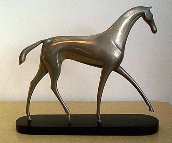 Exquisite nickeled metal horse sculpture by Hagenauer.  Signed wHw in circle, branded on wood base. Raised feet show the horse in motion.  All original conditon, including base. Original patina. No repairs, dents, or damage.  Horse is 10 3/4 inches