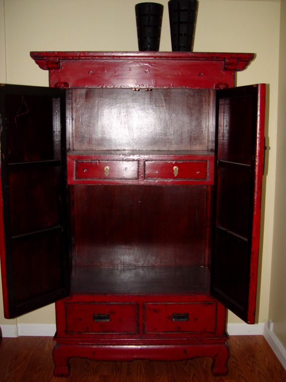 Tall red lacquer armoire.Lots of storage inside.China circa 1900-10.
