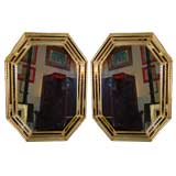 A pair of gold wooden mirror