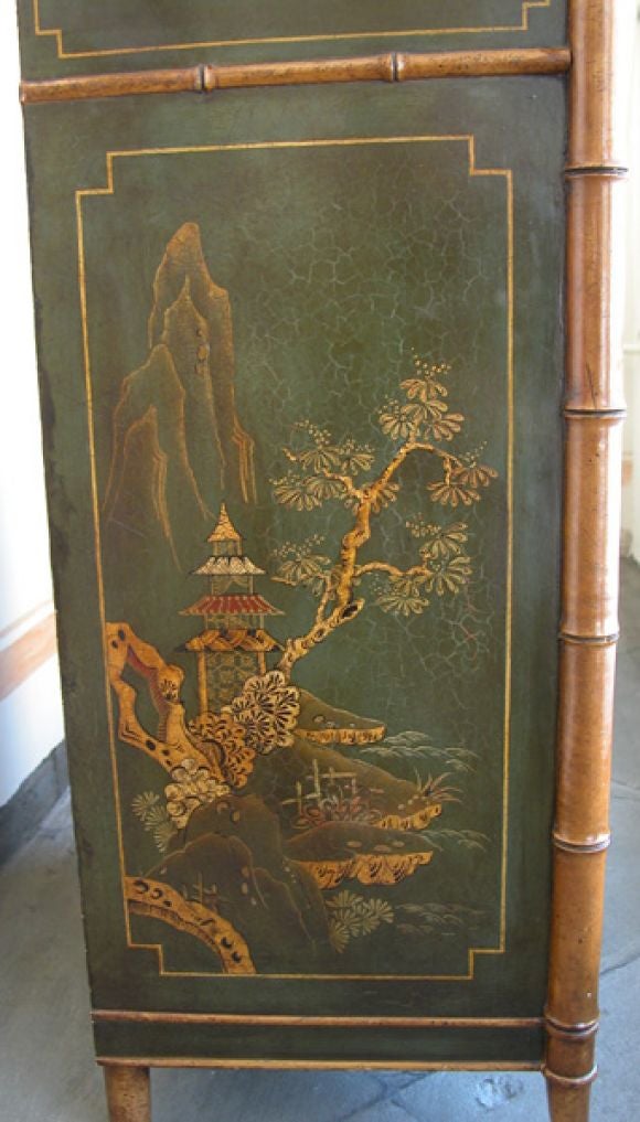 a elegant pair of english regency-style green japanned and faux bamboo concave two-door side cabinets adorned with gilt chinoiserie decoration; with later green marble tops; crackling to lacquer