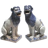 massive pair of french polychromed faience seated lions