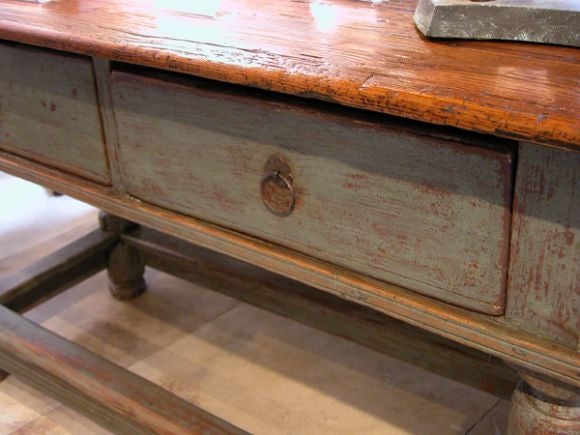 with elmwood top and raised on bulbous supports joined by low stretchers