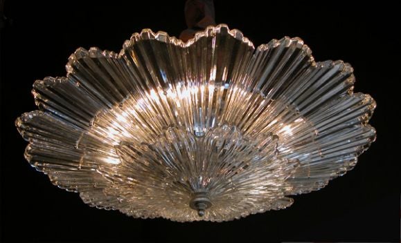 An impressive American art deco style-two-tier starburst ceiling light fitted with French clear glass radiating glass elements; removed from a Michigan Avenue Hotel, Chicago
