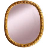 A Massive Italian Neoclassical Giltwood Oval Mirror A Massive Italian Neoclassical Giltwood Oval Mirror