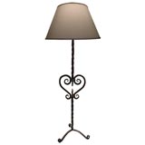 A French Wrought Iron Floor Lamp on a Tripod Base