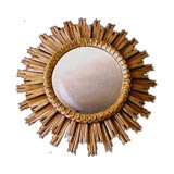 A Large-Scaled French 1940's Carved Giltwood Sunburst Mirror