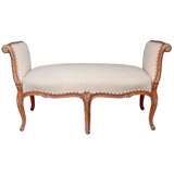 A French Rococo-Style Coral Painted and Parcel Gilt Bench