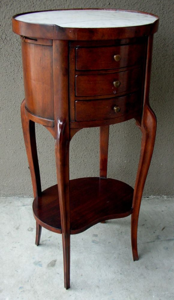 A Diminutive French Rococo Style Mahogany Oval Side Table