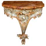 An Elaborately Carved Italian Rococo Painted Hanging Console