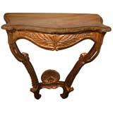 A Rare French Regence Carved Giltwood Serpentine Form Console