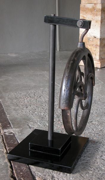 A Curious Pair of American Industrial Iron Pulleys