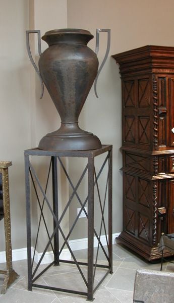 A Monumental Pair of American Art Deco Double-Handled Iron Urns on Later Stands In Good Condition In San Francisco, CA