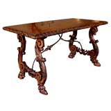 A Spanish Baroque Carved Walnut and Rosewood Trestle Table