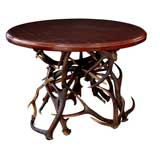 A Scottish Circular Side table with Antler Base and Leather Top