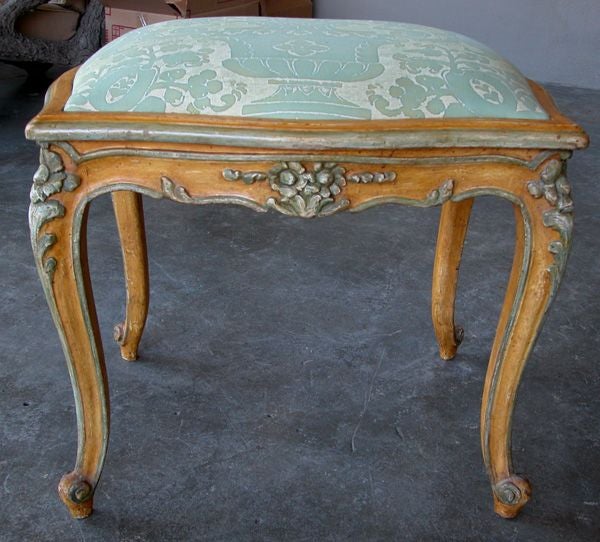 A French Louis XV Ochre Painted Serpentine-Form Stool with Celadon Highlights