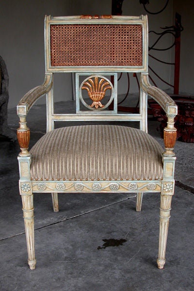 An Elegant Pair of English Sheraton Style Pale-Green Painted and Parcel-Gilt Armchairs with Caned Backs