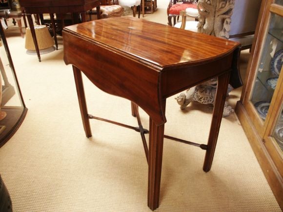 Great looking butterfly drop leaf pembroke table with x stretcher and one drawer.