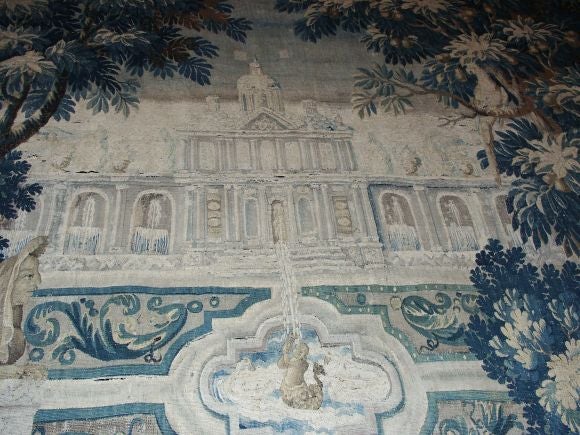 Wonderful 18th C tapestry depicting a pavilion with fountains in the foreground, a parrot and a squirel amid trees with complete border of fruit, leaves  and birds.