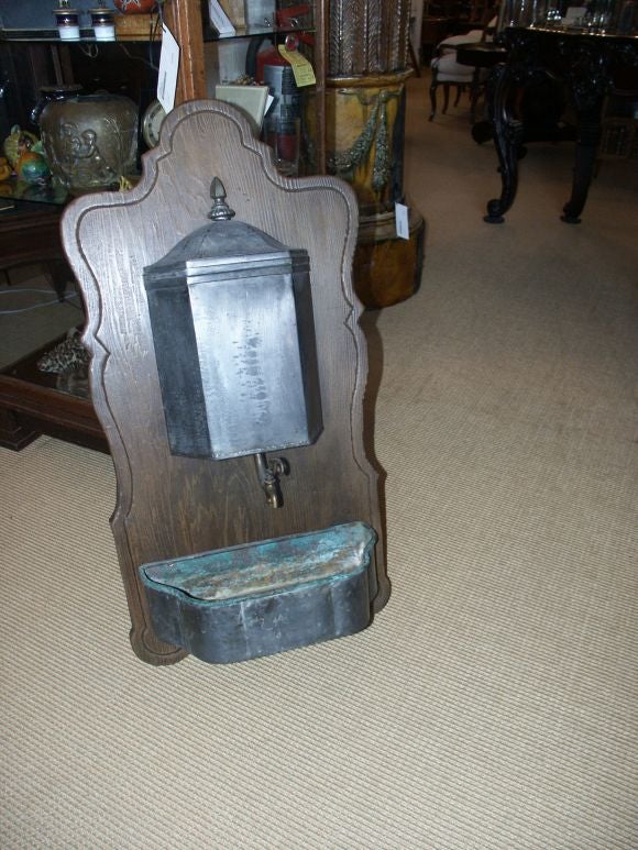 Wonderful antique pewter Lavabo mounted on wood panel