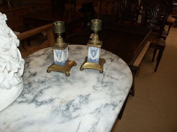 Beautiful pair of blue and white wedgewood candle holders with out the glass lanters or oil lamp attatchments.-  The height will increase when you add the glass lantern shades