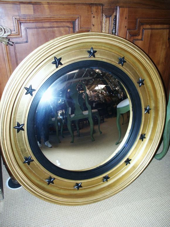 Great looking Carver's Guild bull's eye Federal style mirror made in the US in the second half of the 20th C.
