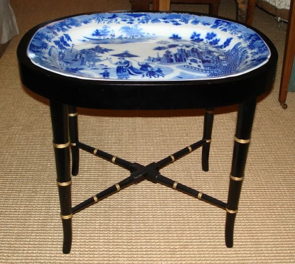 Beautiful large antique blue and white platter mounted in a custom faux bamboo regency style stand to make a tray table.