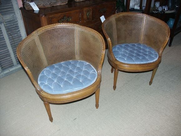 Unusual pair of barrel back french chairs with caned backs